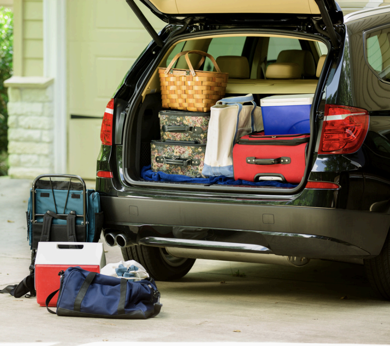 Open trunk of car with luggage