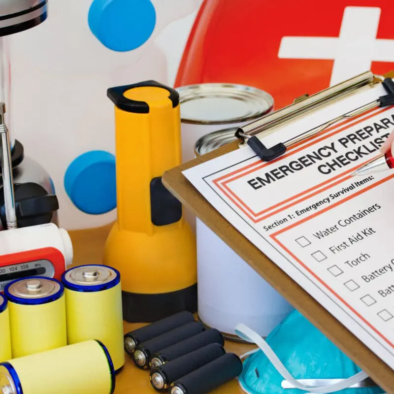 someone filling out an emergency preparation checklist