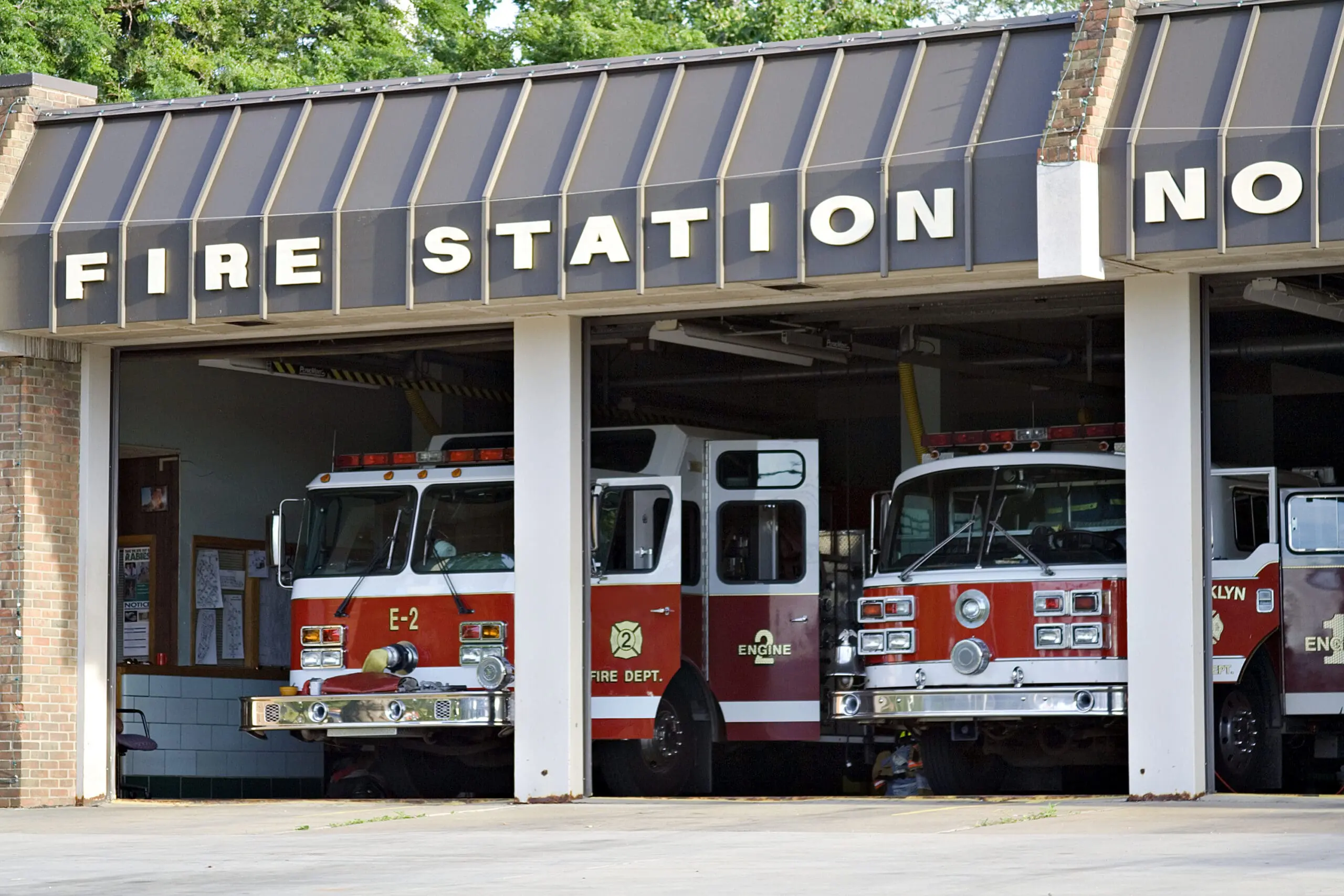 A,City,Fire,Station,-,Doors,Open,And,Trucks,Waiting.