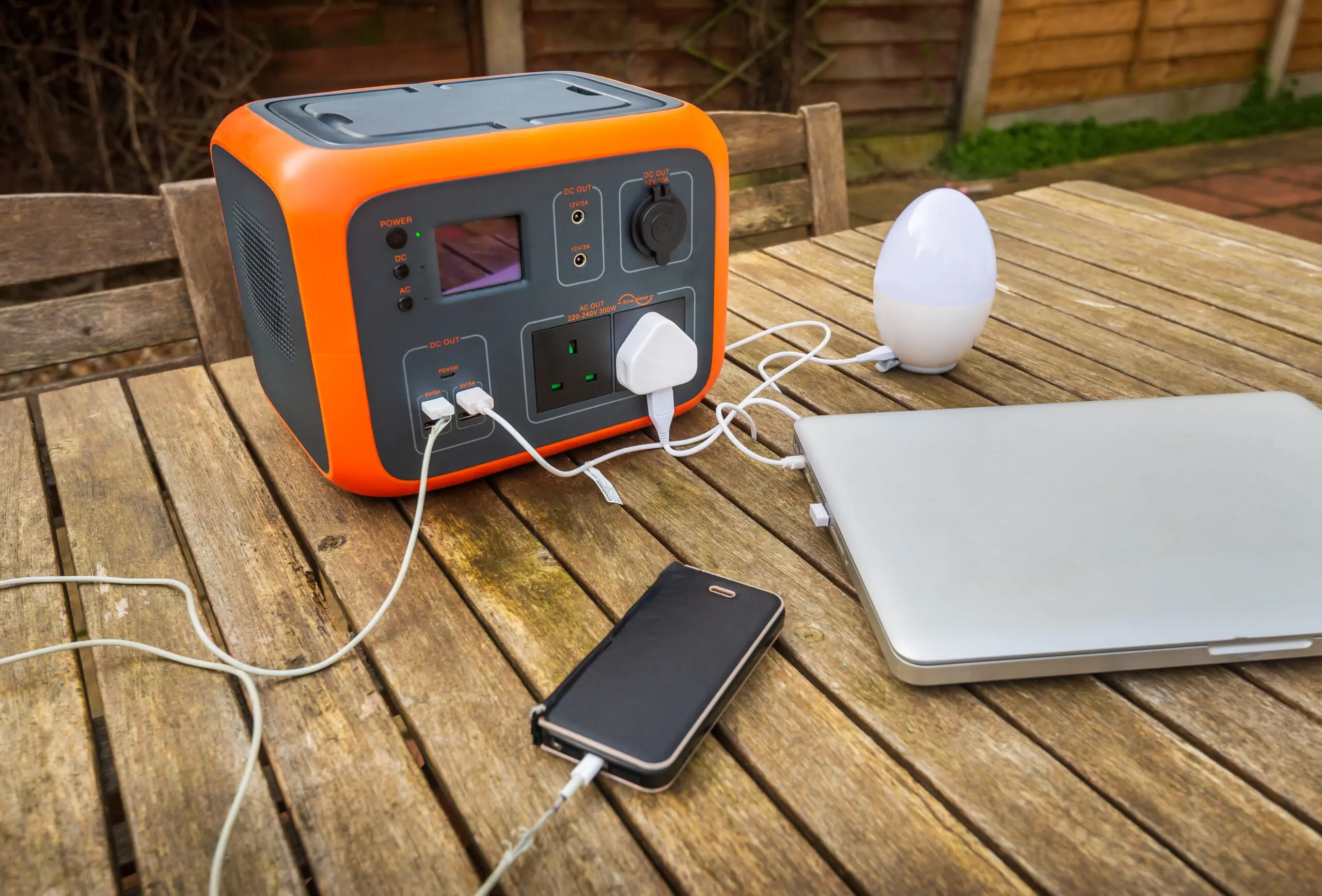 Portable,Power,Station,Solar,Electricity,Generator,Outdoors,On,Wooden,Table