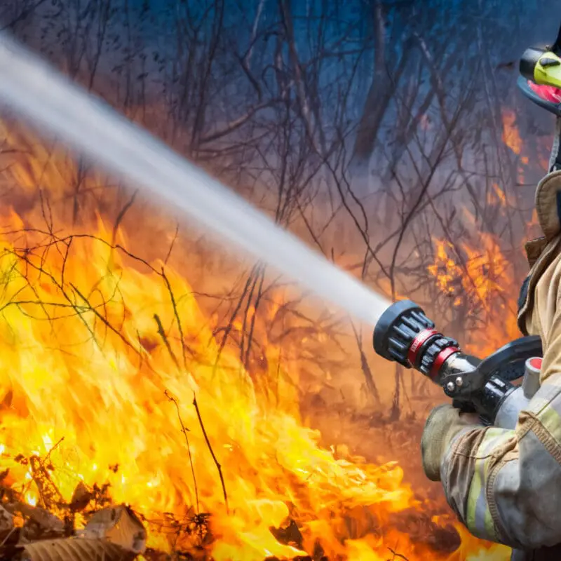 firefighter putting out fire