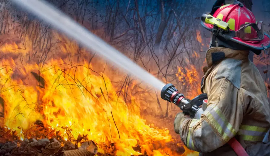 firefighter putting out fire